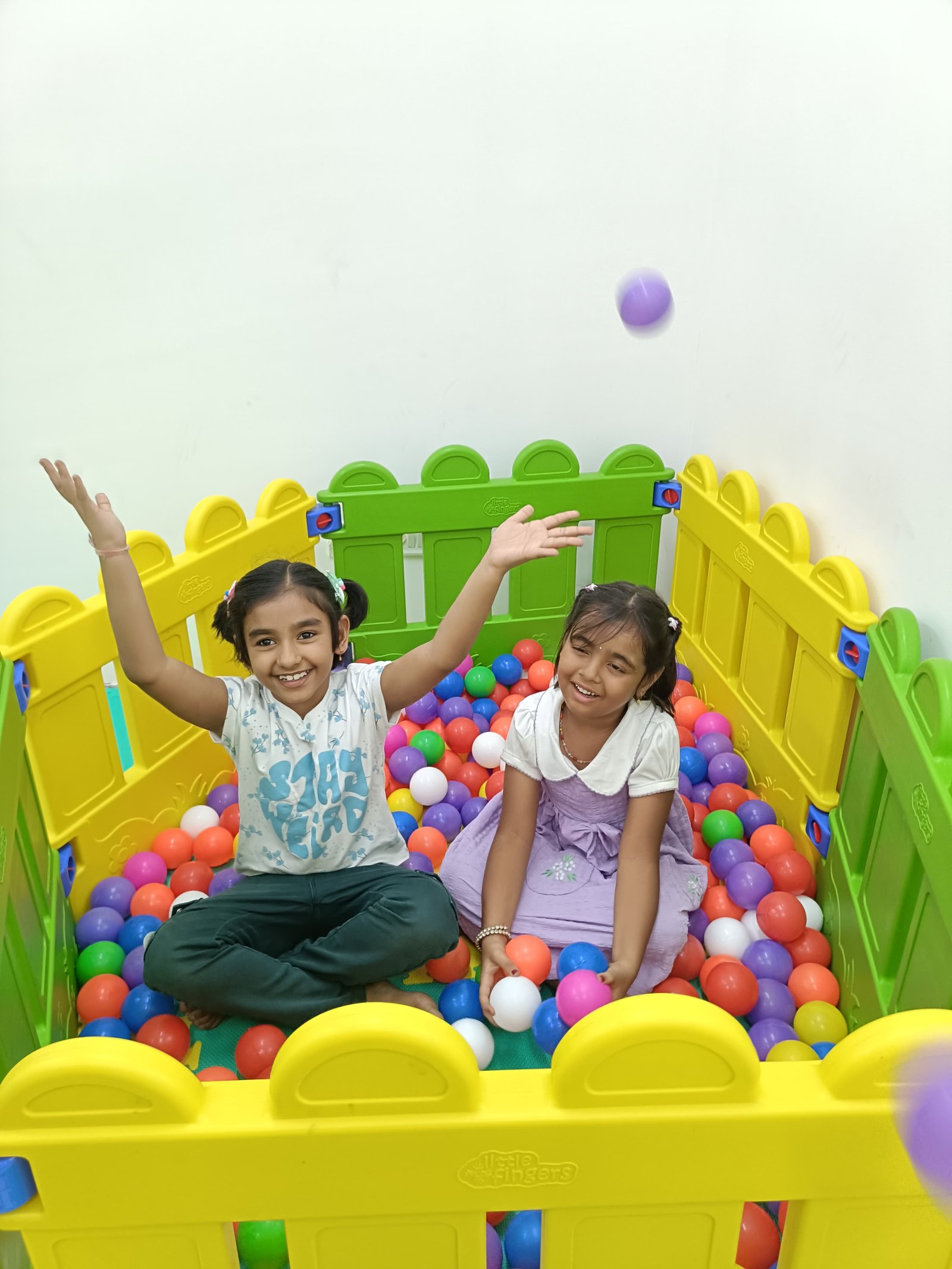 Child exploring colorful sensory materials